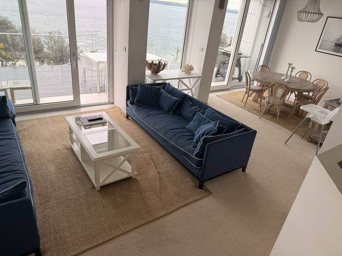 Open plan living and dining area with harbour views